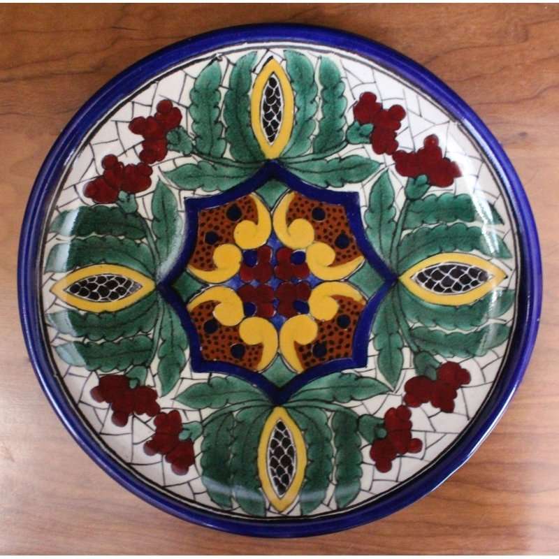 Hand-painted Talavera pottery plate from La Corona workshop in Tlaxcala, Mexico, featuring traditional mineral-based paints and unique designs, durable and lead-free.