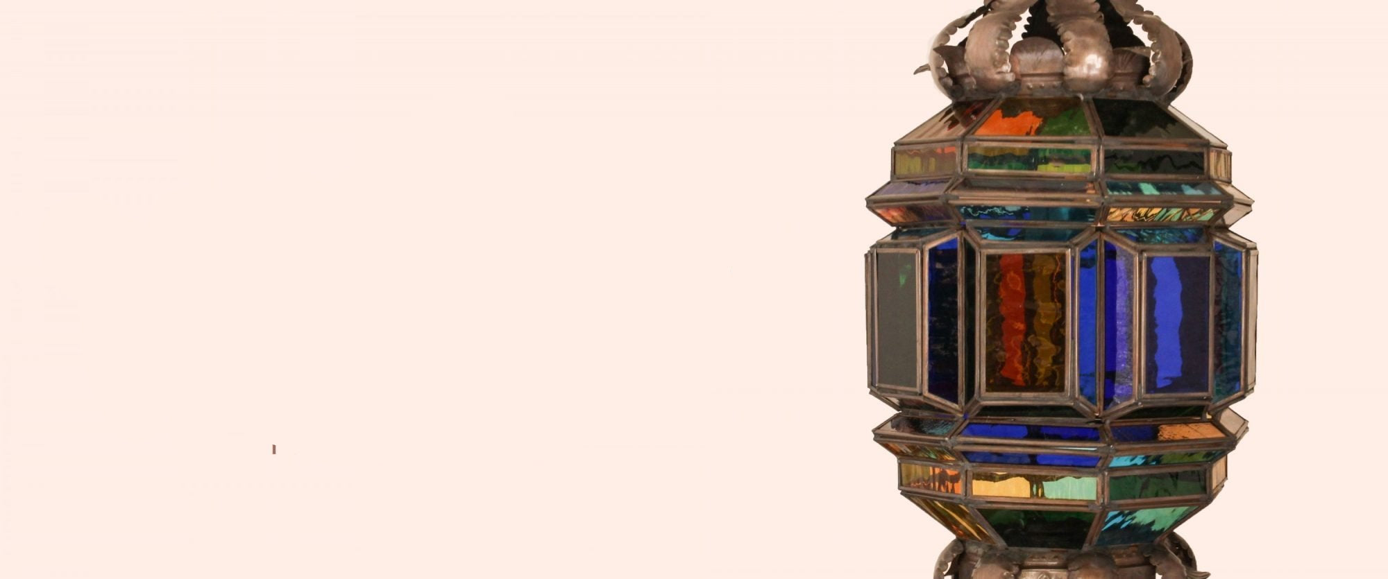 Decorative lantern with stained glass design on a beige background