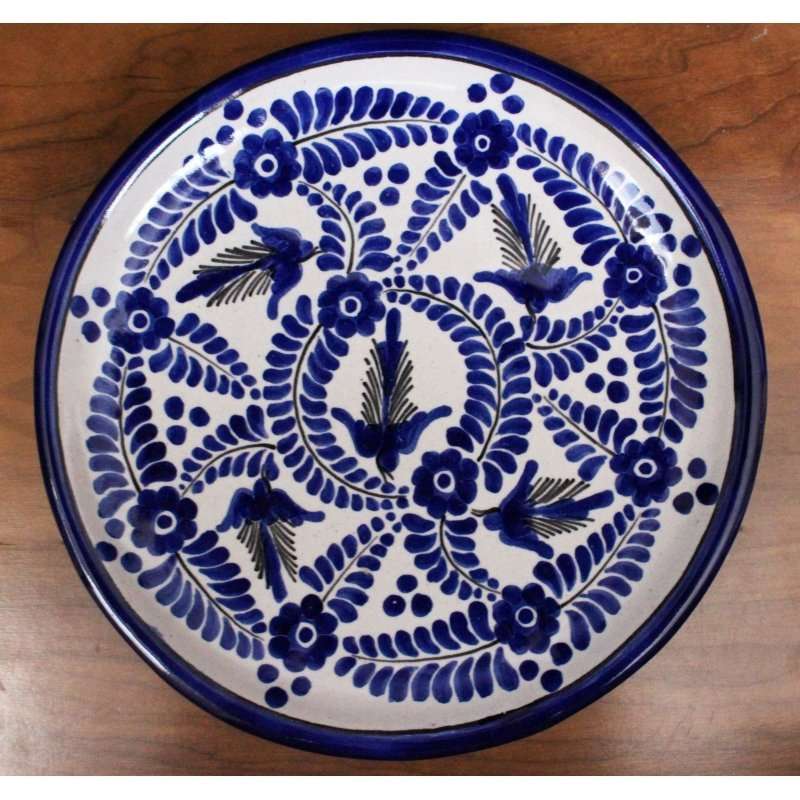 Blue Talavera dinner plate with traditional hand-painted floral and bird patterns from La Corona workshop in Tlaxcala Mexico
